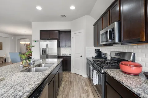a kitchen with granite countertop lots of counter top space