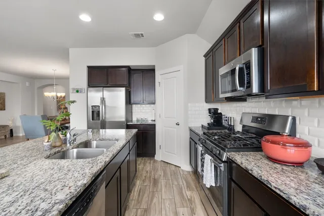 a kitchen with granite countertop lots of counter top space