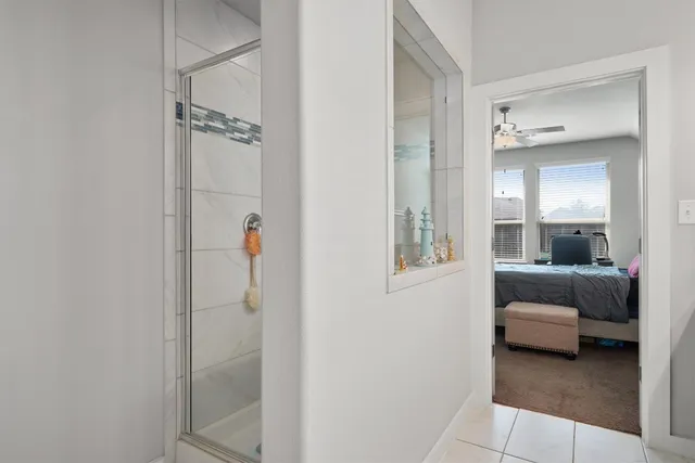 a en suite bathroom with a sink and a mirror