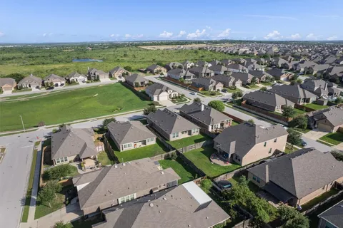 an aerial view of a house with a garden