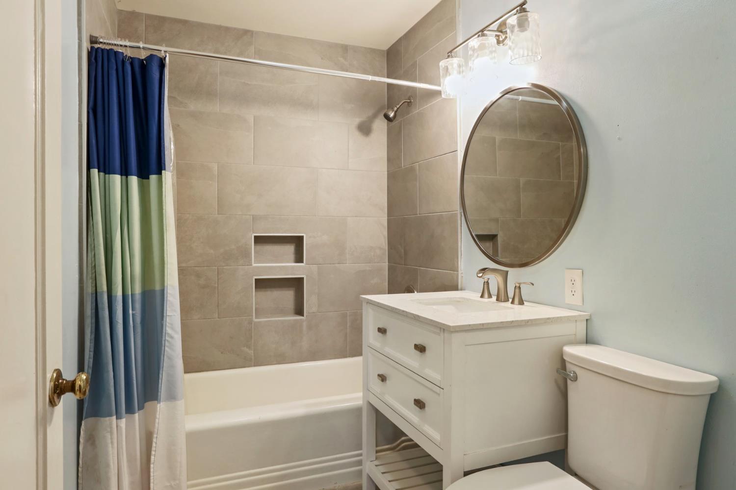 2755 Inman Avenue Stockton, CA 95204 - Photo 14 of 34 a bathroom with a sink toilet and shower