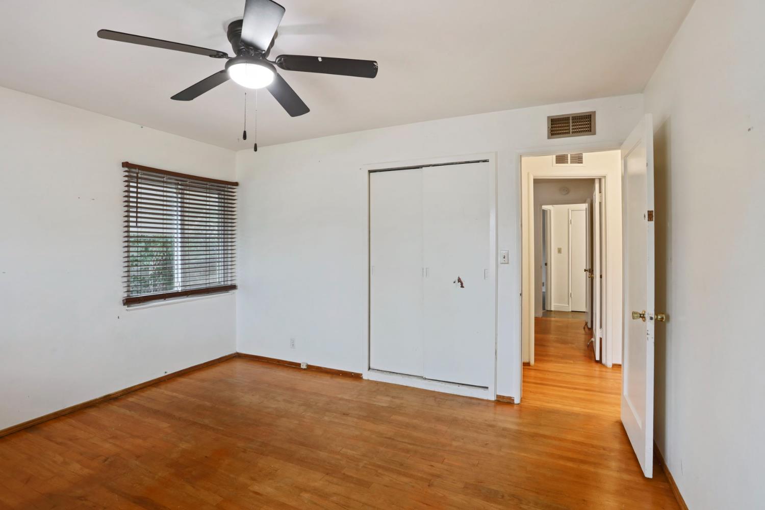 2755 Inman Avenue Stockton, CA 95204 - Photo 16 of 34 a view of empty room with wooden floor and fan