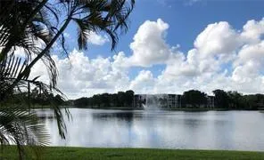 a view of lake with green space