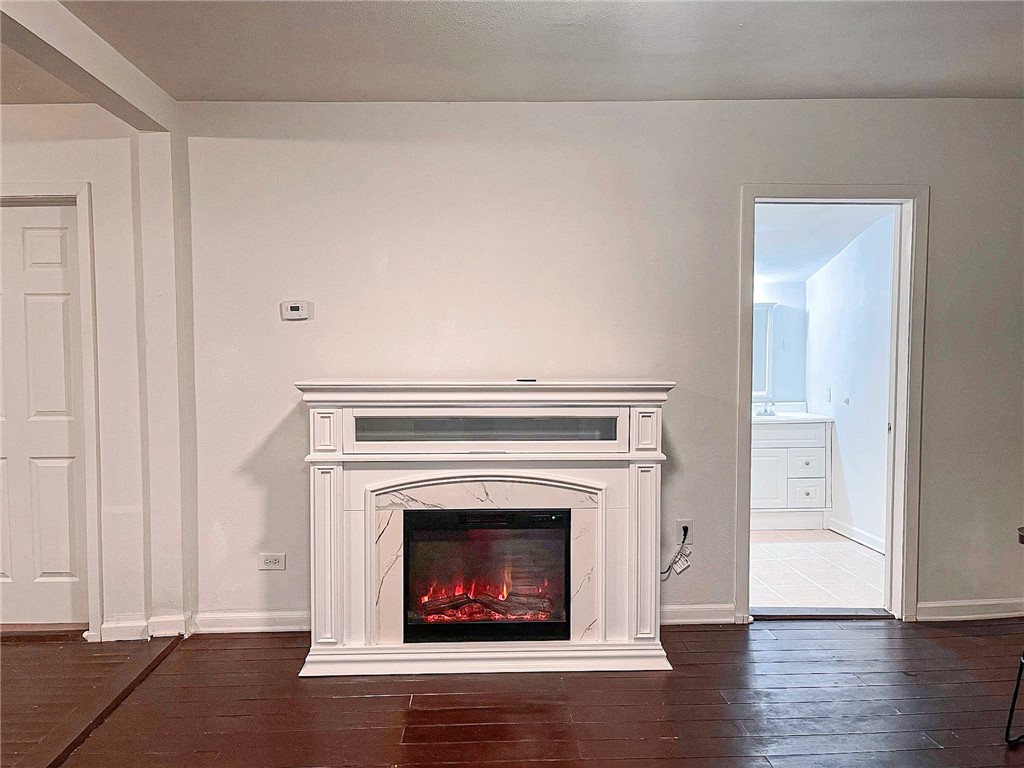 129 Illinois Avenue China Spring, TX 76633 - Photo 4 of 11 a living room with a fireplace