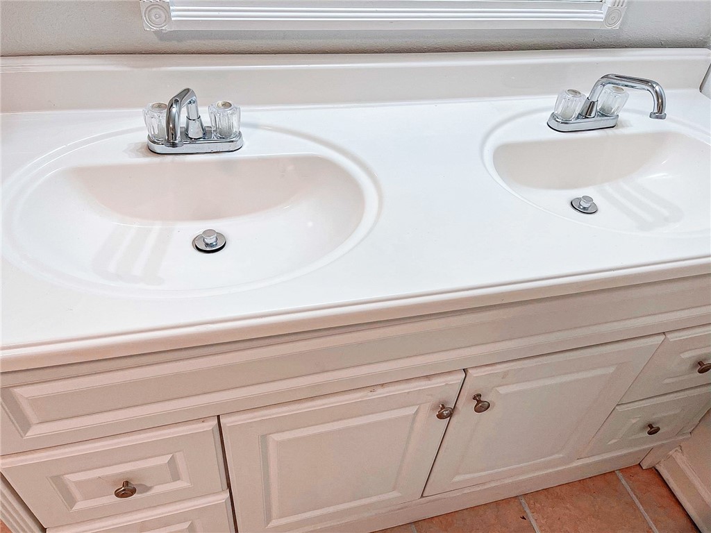 129 Illinois Avenue China Spring, TX 76633 - Photo 7 of 11 a bathroom with a sink and a mirror