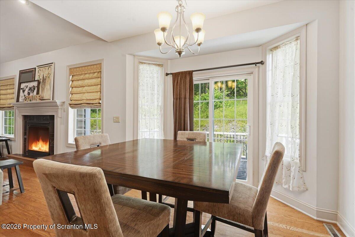 99 Hilltop Road Waverly, PA 18471 - Photo 13 of 41 a view of a dining room with furniture window and outside view