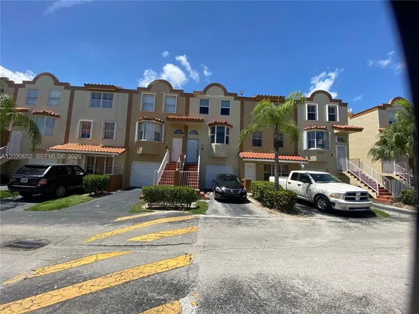 a car parked in front of a house