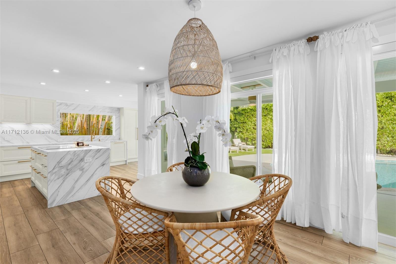 345 Gulf Road Key Biscayne, FL 33149 - Photo 11 of 43 a dining room with furniture and window