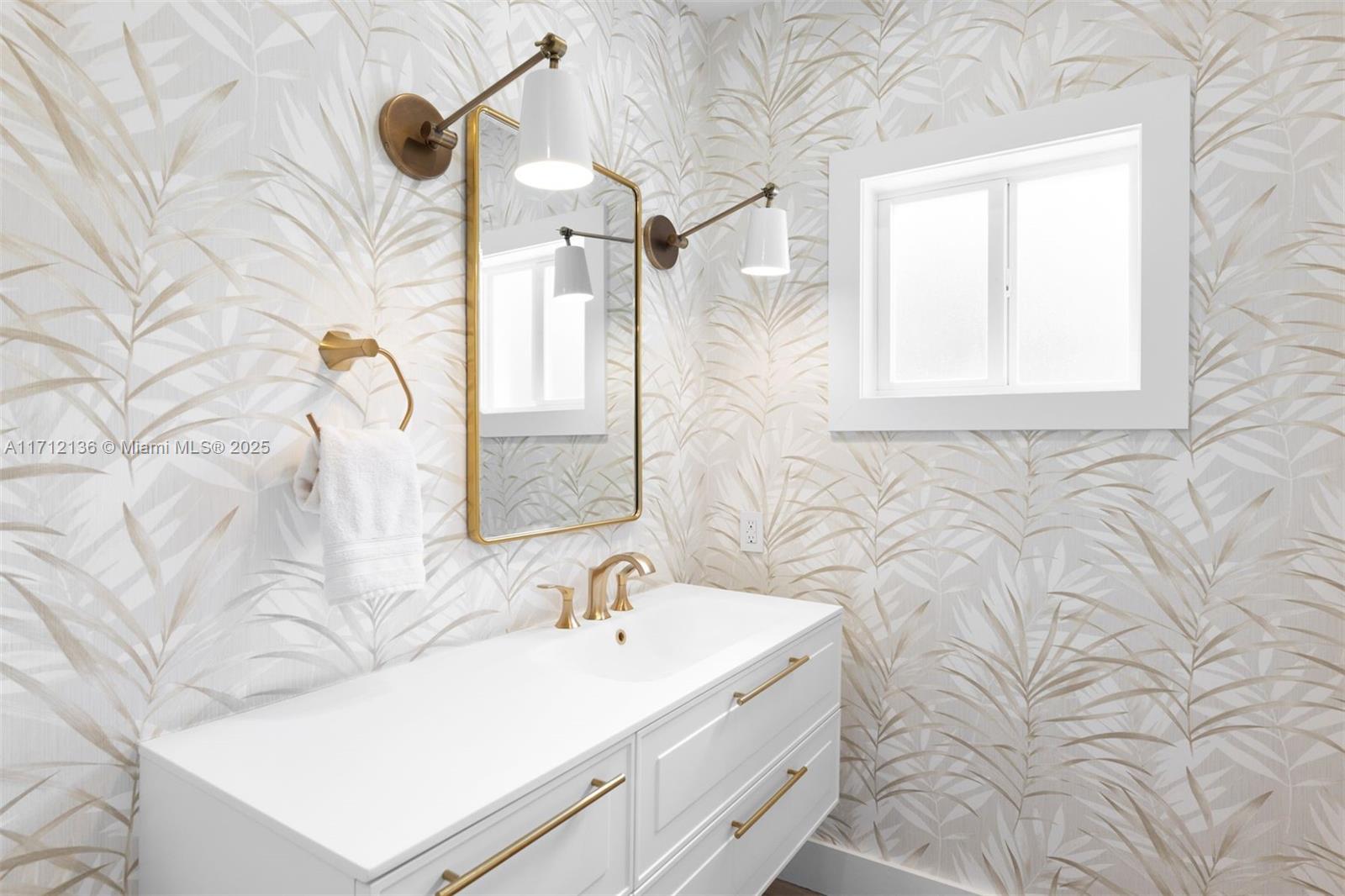 345 Gulf Road Key Biscayne, FL 33149 - Photo 15 of 43 a bathroom with a sink and a mirror