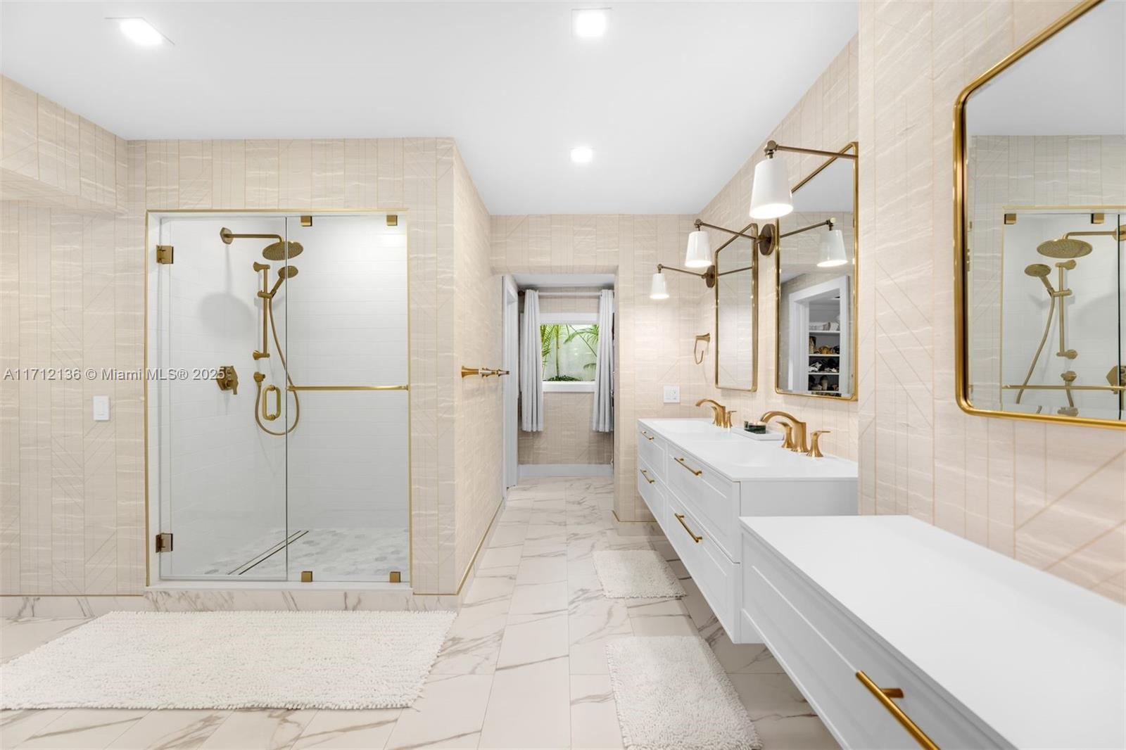 345 Gulf Road Key Biscayne, FL 33149 - Photo 19 of 43 a bathroom with a tub a mirror and shower