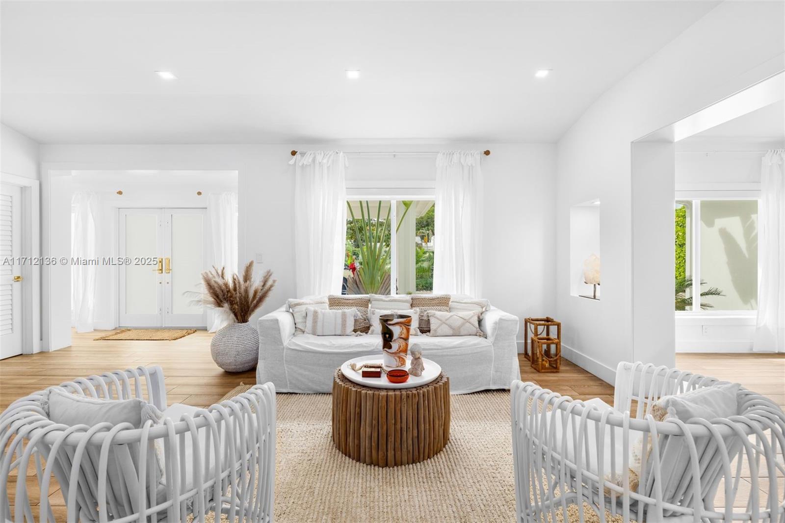 345 Gulf Road Key Biscayne, FL 33149 - Photo 2 of 43 a living room with furniture and a large window