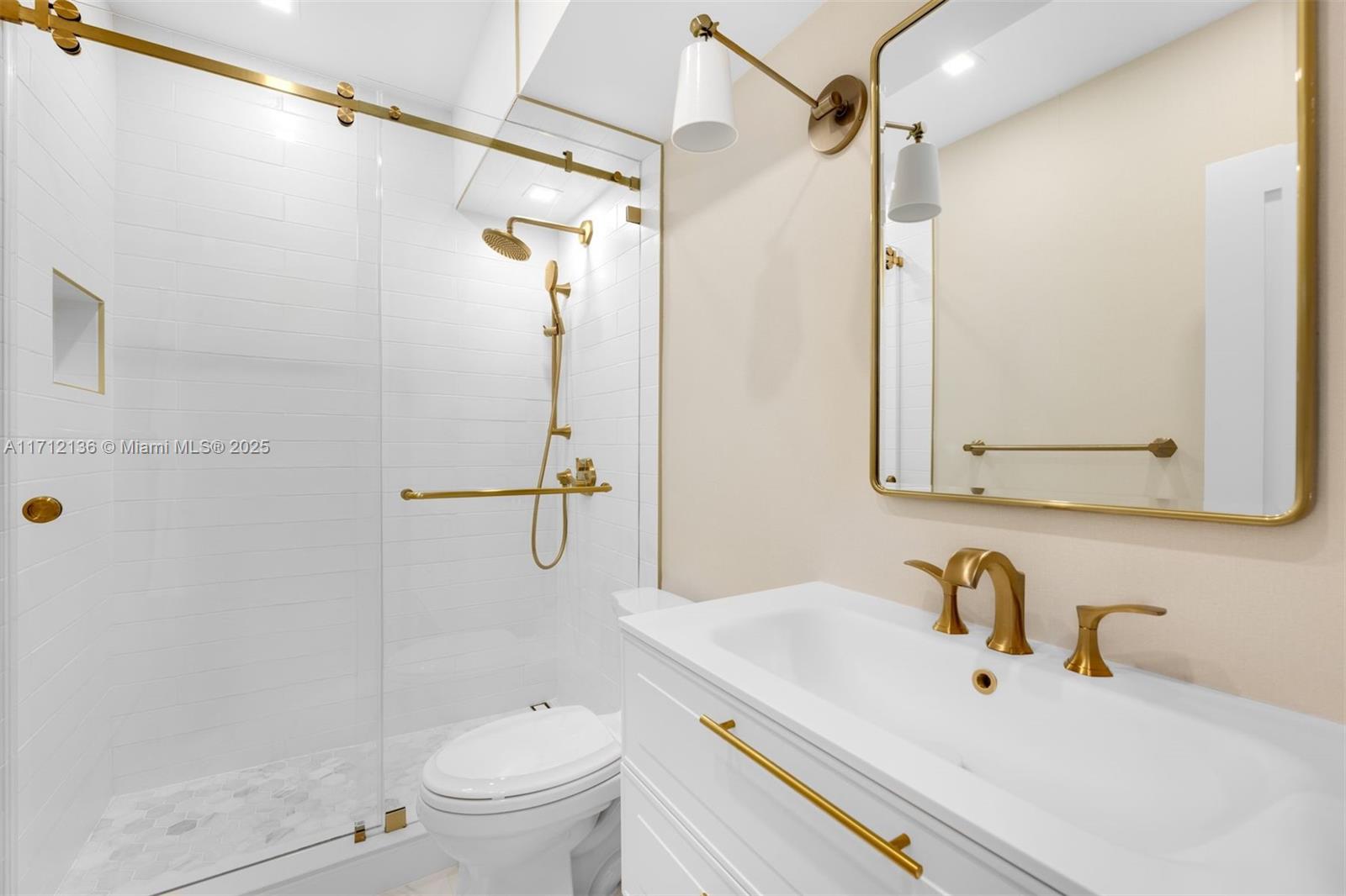 345 Gulf Road Key Biscayne, FL 33149 - Photo 23 of 43 a bathroom with a sink toilet and shower