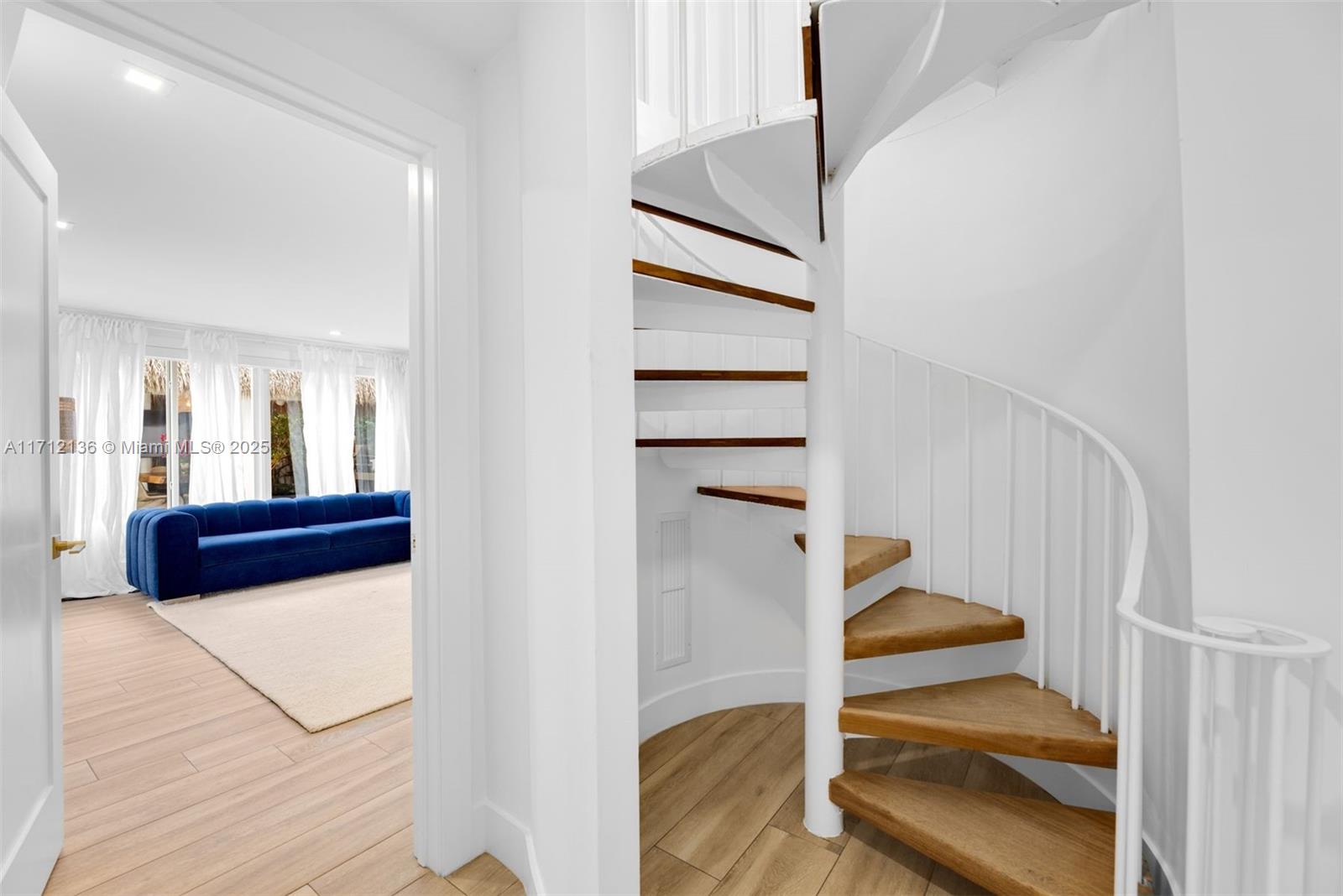345 Gulf Road Key Biscayne, FL 33149 - Photo 26 of 43 a view of entryway and hall with wooden floor