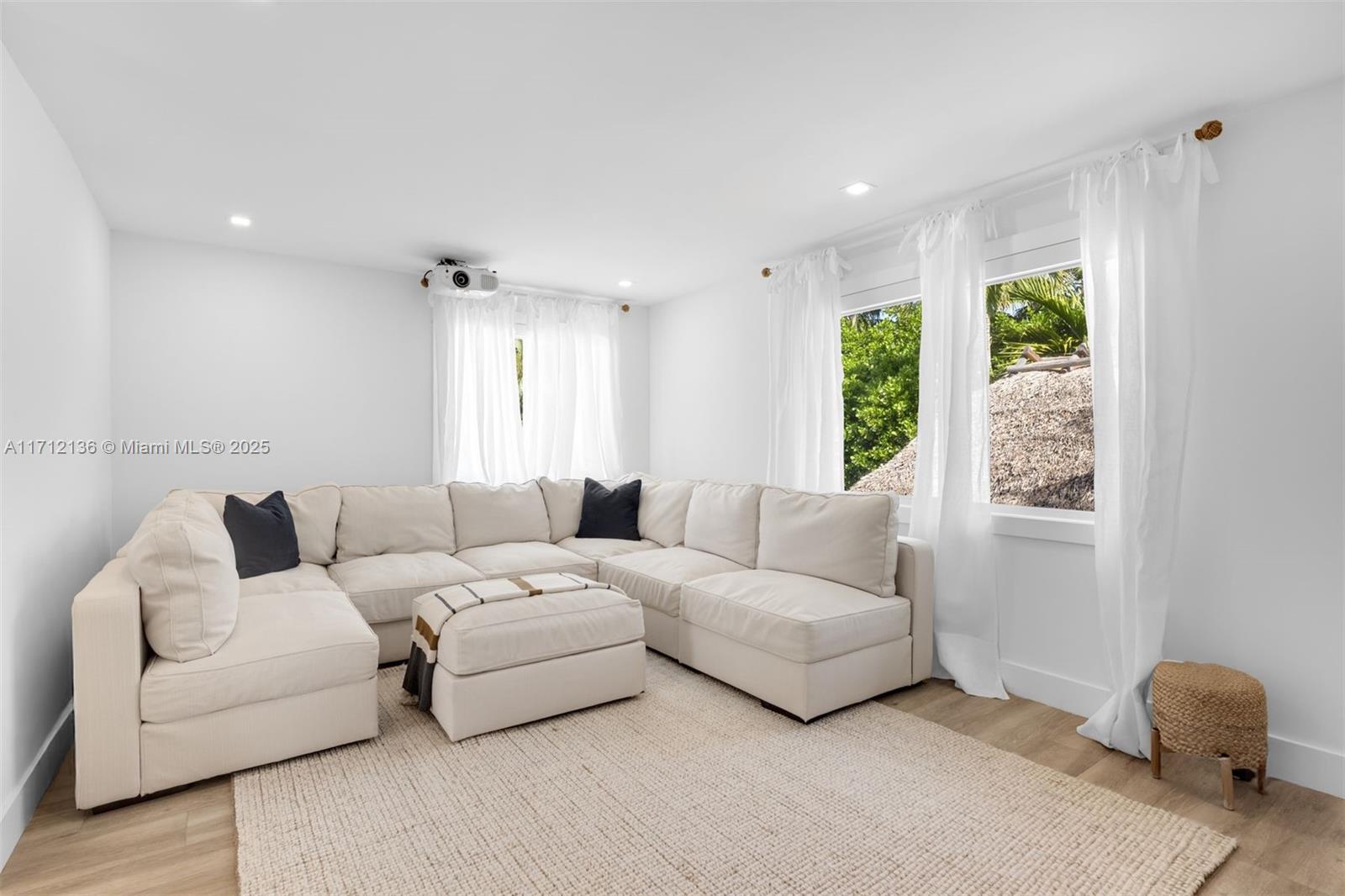 345 Gulf Road Key Biscayne, FL 33149 - Photo 27 of 43 a living room with furniture and a large window