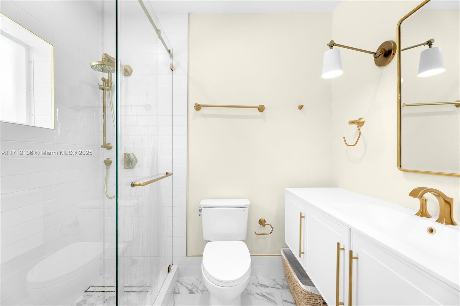 345 Gulf Road Key Biscayne, FL 33149 - Photo 29 of 43 a bathroom with a sink a toilet and shower