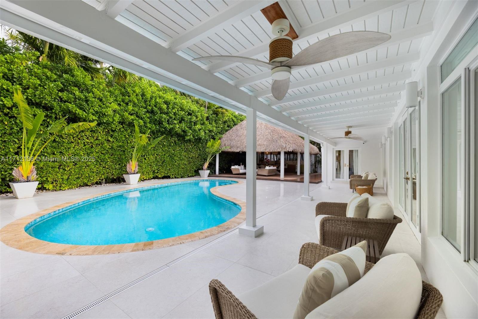 345 Gulf Road Key Biscayne, FL 33149 - Photo 30 of 43 a view of a house with a swimming pool