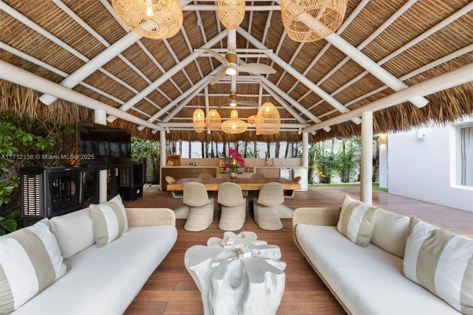 345 Gulf Road Key Biscayne, FL 33149 - Photo 33 of 43 a outdoor living space with patio furniture and a ceiling fan