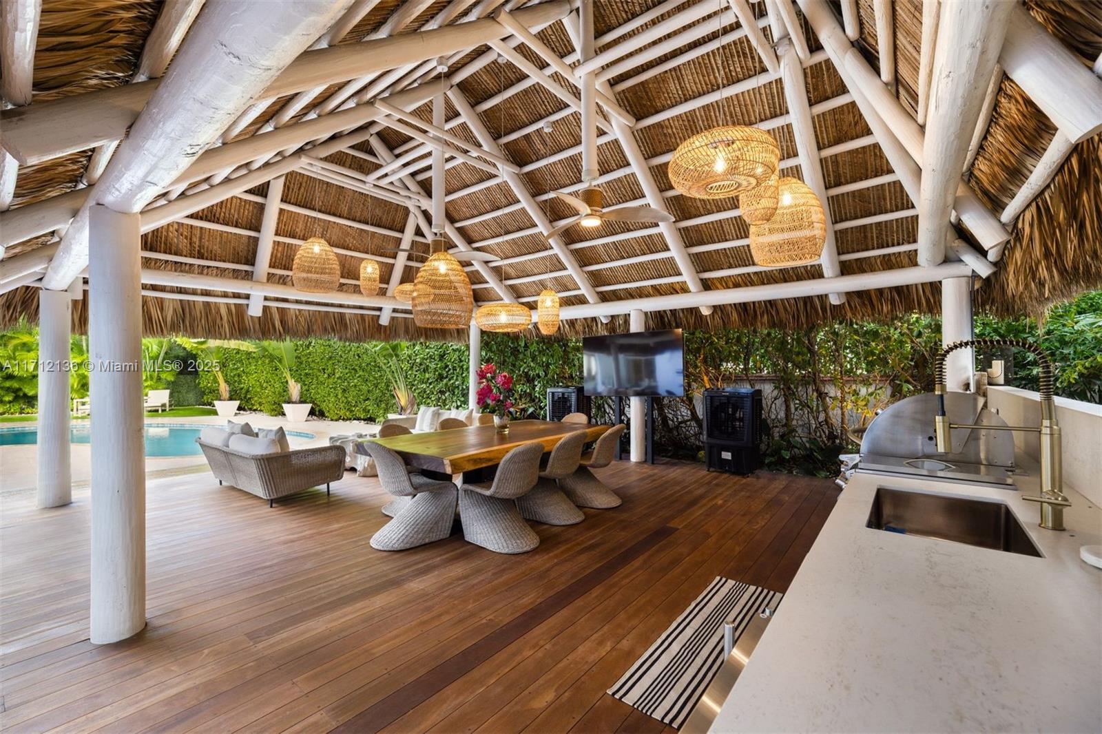 345 Gulf Road Key Biscayne, FL 33149 - Photo 36 of 43 a view of a patio with couches and potted plants