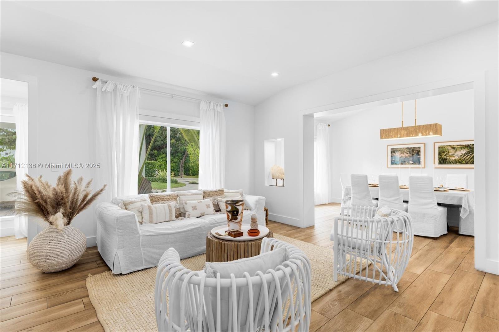 345 Gulf Road Key Biscayne, FL 33149 - Photo 4 of 43 a living room with furniture and a large window