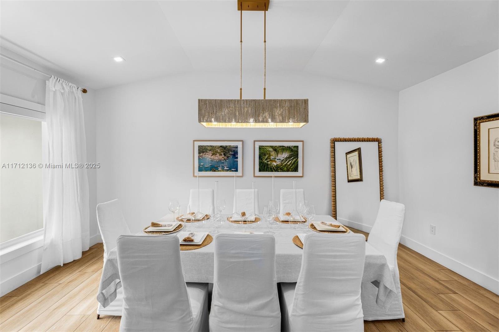 345 Gulf Road Key Biscayne, FL 33149 - Photo 5 of 43 a view of a dining room with furniture and wooden floor