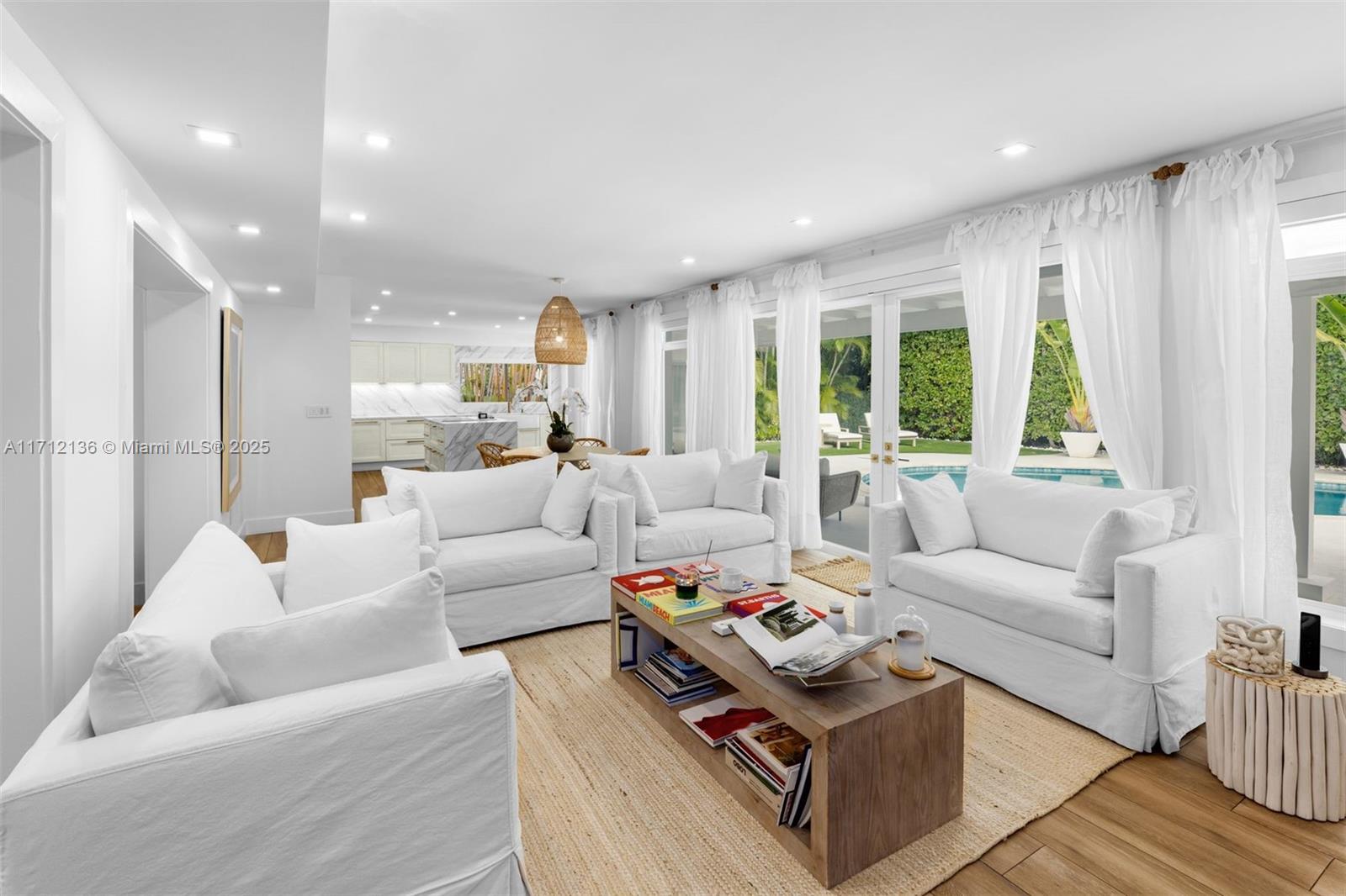 345 Gulf Road Key Biscayne, FL 33149 - Photo 7 of 43 a living room with furniture and a large window