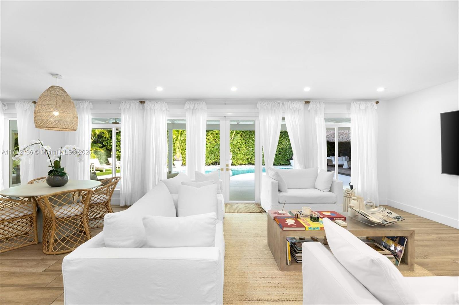 345 Gulf Road Key Biscayne, FL 33149 - Photo 10 of 43 a living room with furniture and wooden floor