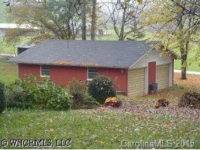 1395 Iron Duff Road Waynesville, NC 28785 - Photo 3 of 7 a front view of a house with garden