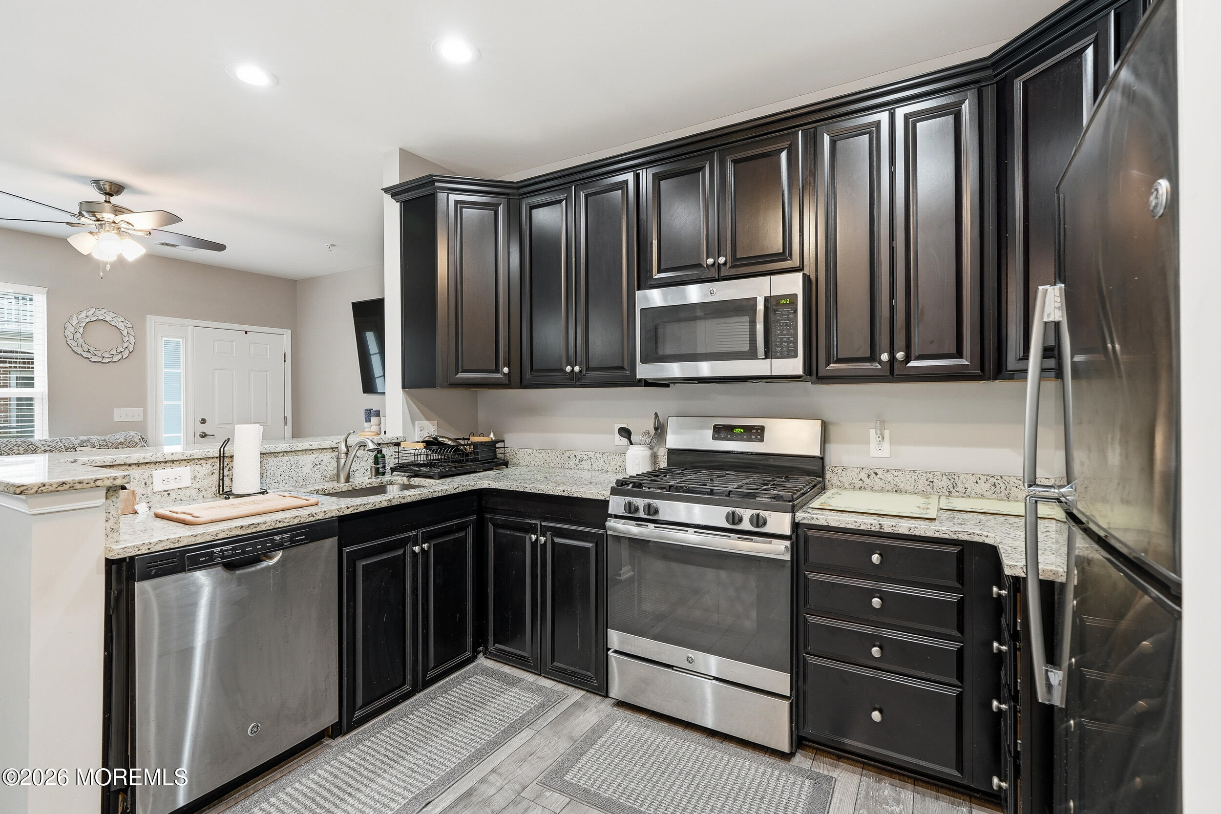 4 Kyle Drive Tinton Falls, NJ 07712 - Photo 11 of 28 a kitchen with a sink stove and microwave
