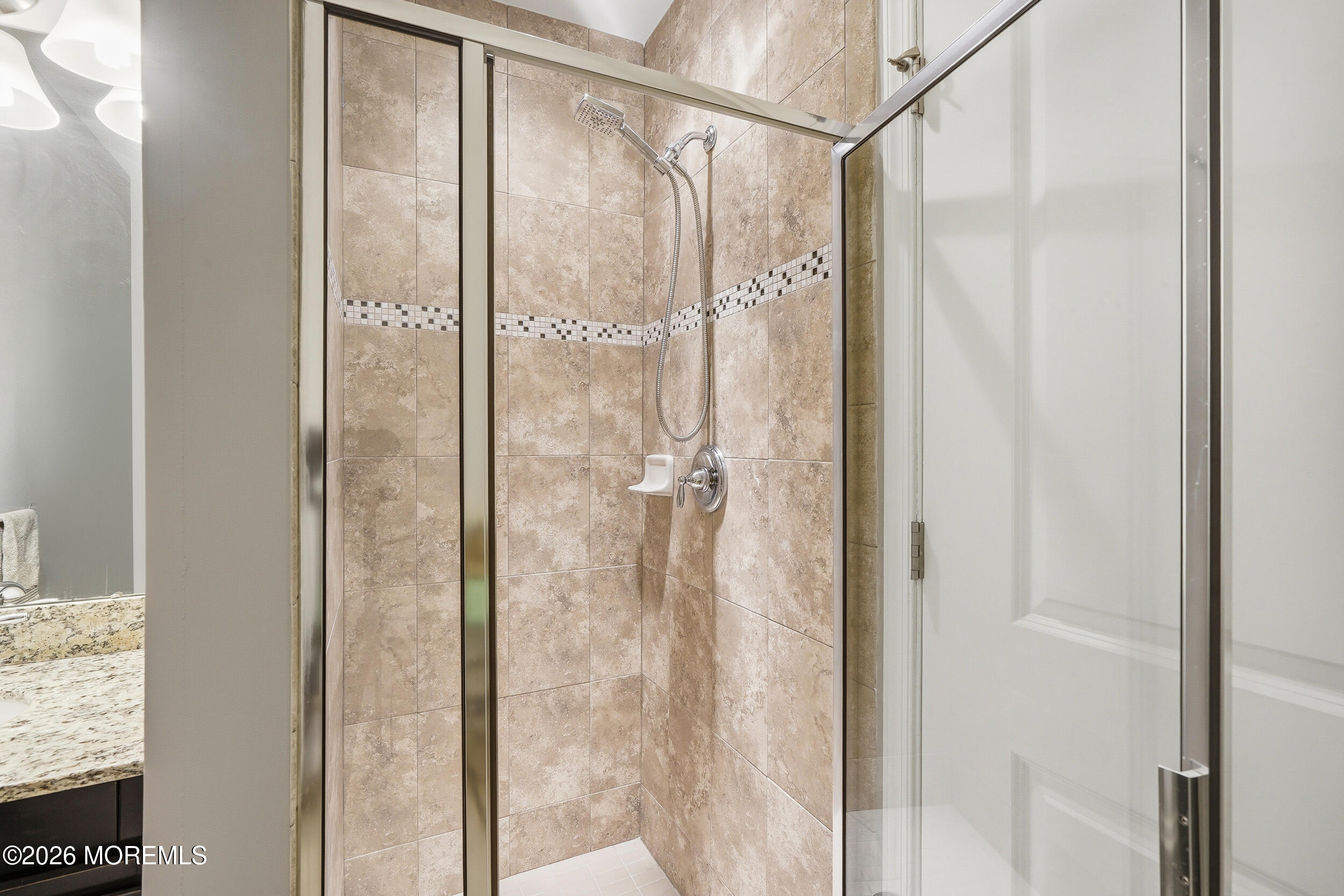 4 Kyle Drive Tinton Falls, NJ 07712 - Photo 14 of 28 a bathroom with a glass shower door