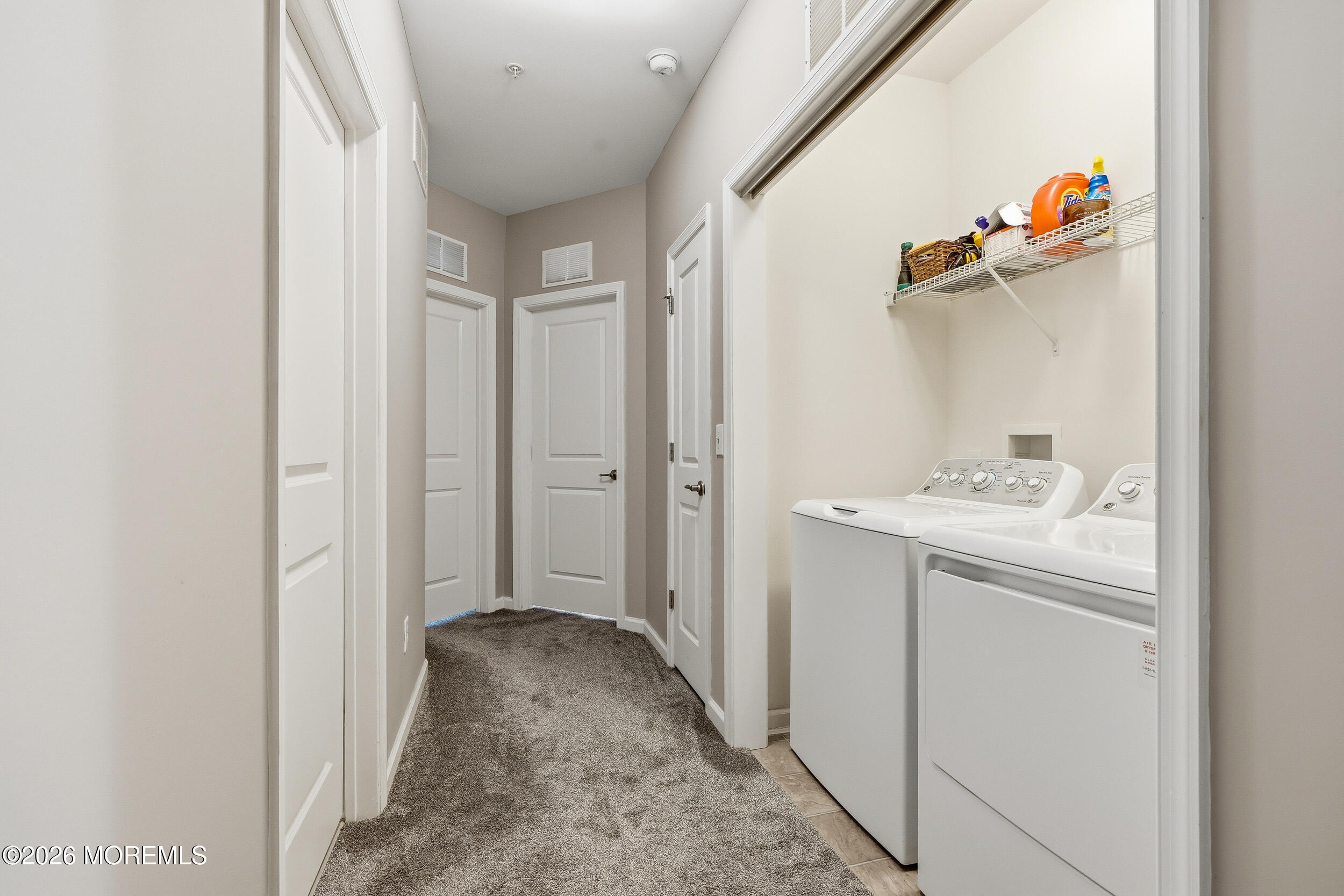 4 Kyle Drive Tinton Falls, NJ 07712 - Photo 16 of 28 a bathroom with a sink mirror and a shower