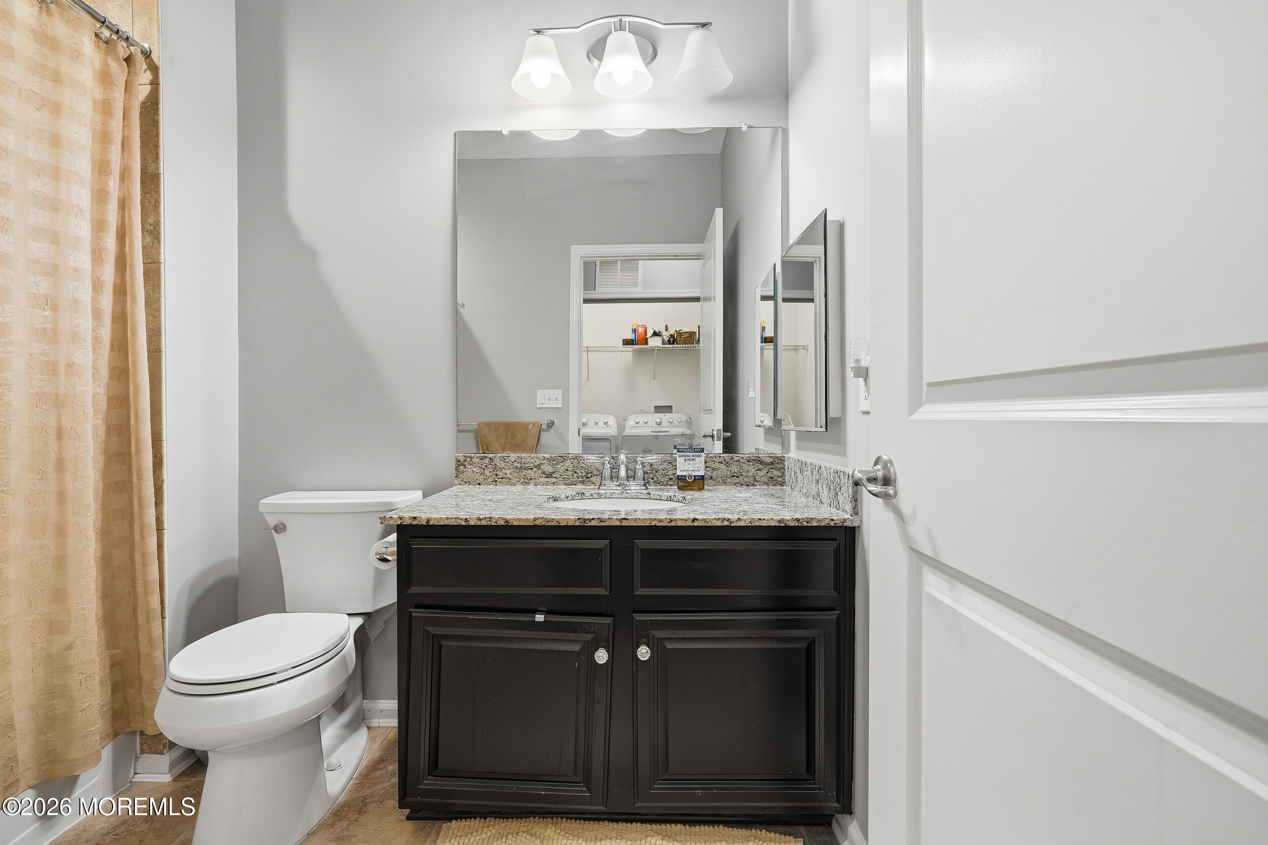 4 Kyle Drive Tinton Falls, NJ 07712 - Photo 17 of 28 a bathroom with a sink a toilet and a mirror