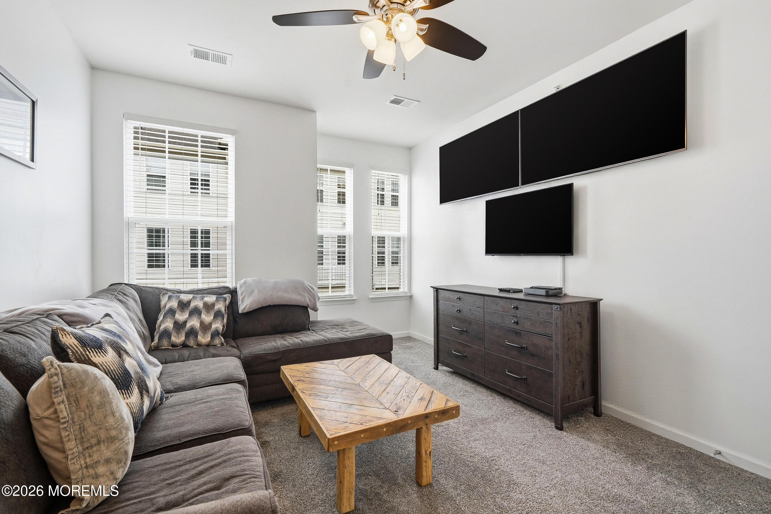 4 Kyle Drive Tinton Falls, NJ 07712 - Photo 20 of 28 a living room with furniture and a flat screen tv