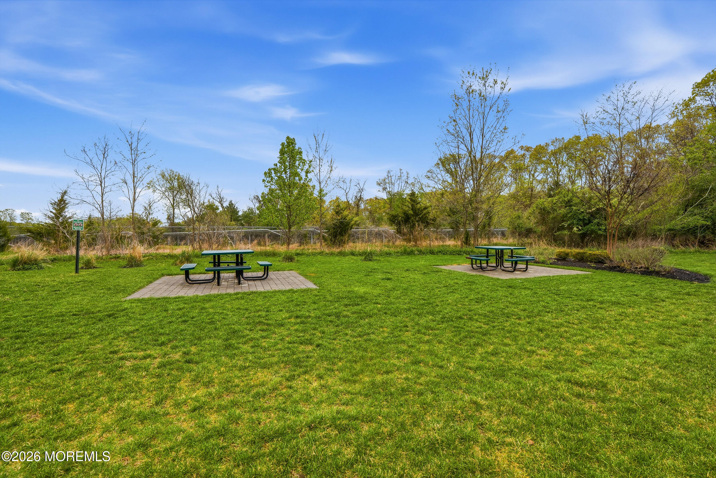 4 Kyle Drive Tinton Falls, NJ 07712 - Photo 25 of 28 a view of a golf course with a swimming pool