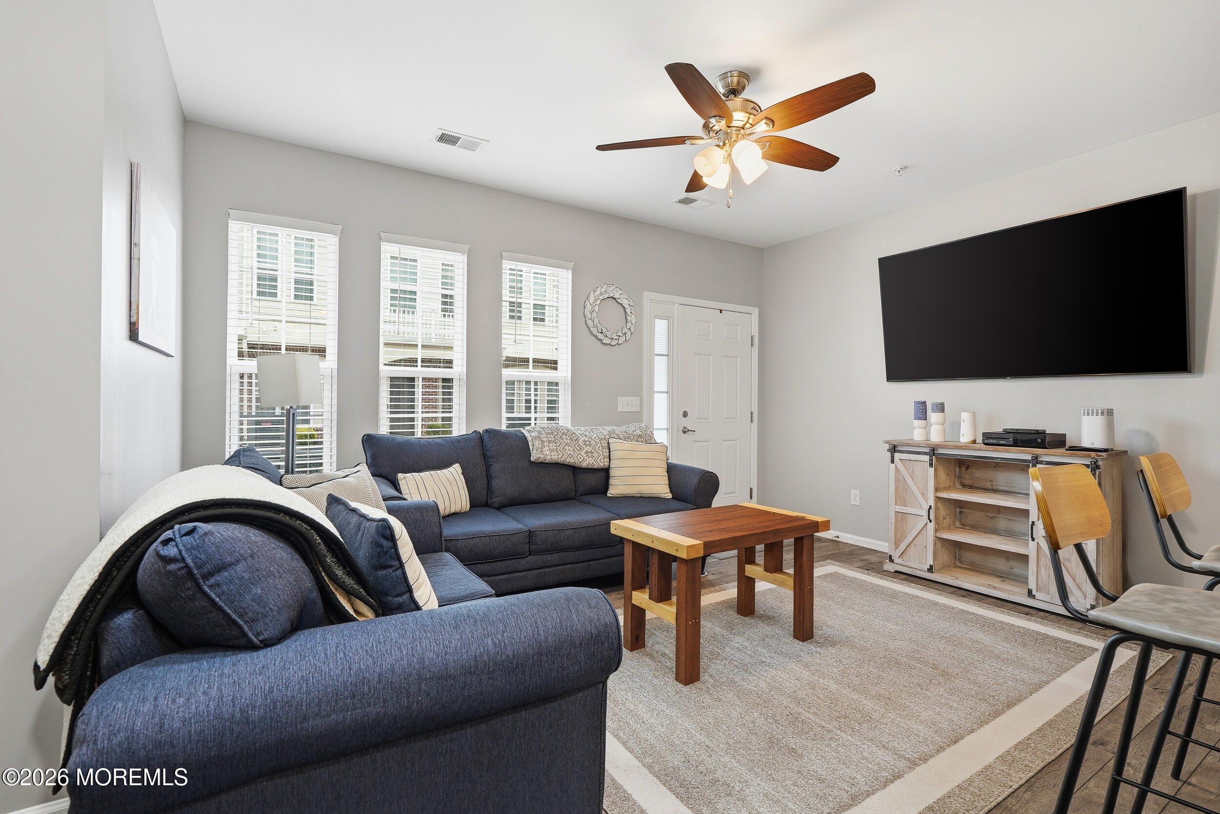 4 Kyle Drive Tinton Falls, NJ 07712 - Photo 6 of 28 a living room with furniture and a flat screen tv