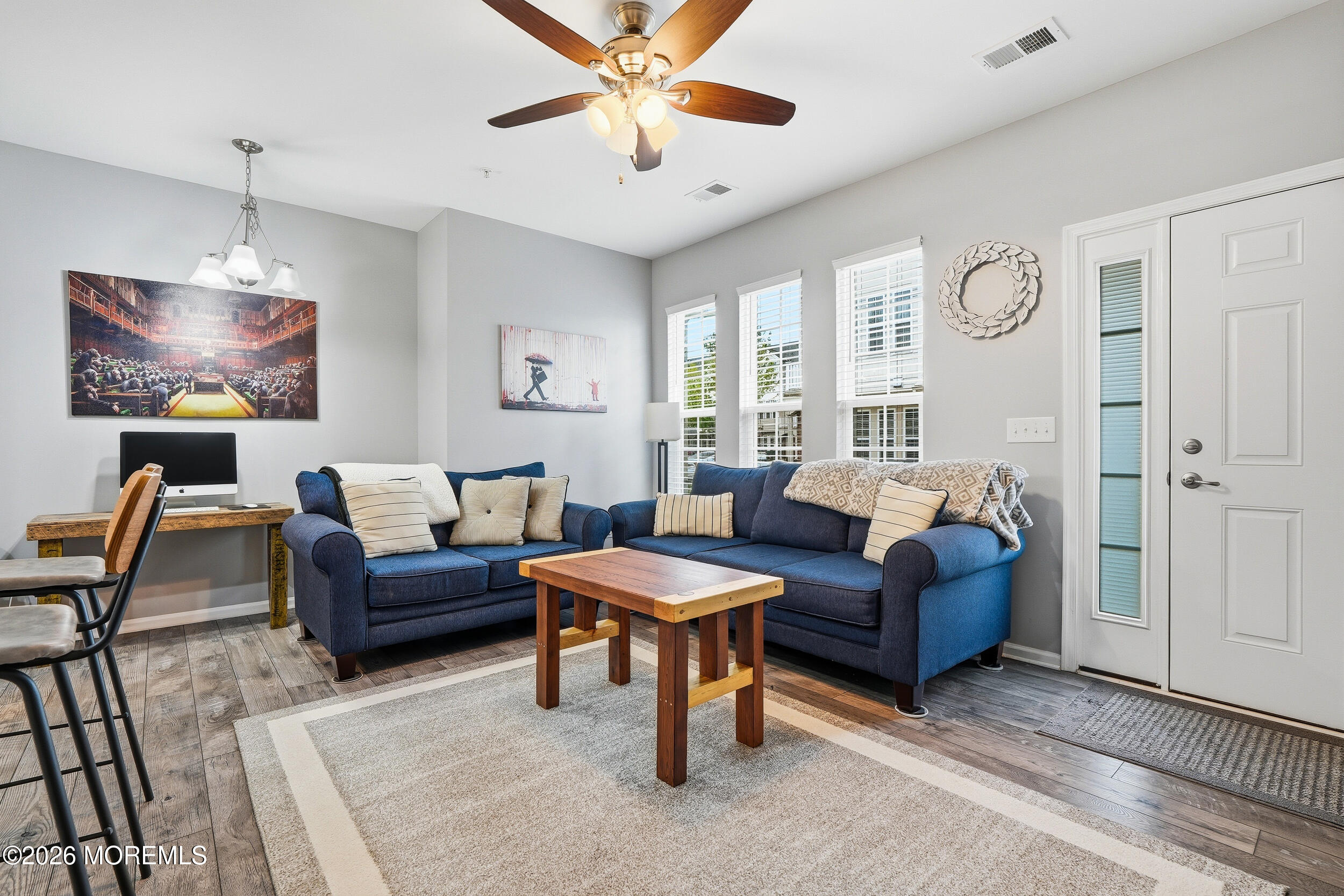 4 Kyle Drive Tinton Falls, NJ 07712 - Photo 7 of 28 a living room with furniture and a chandelier