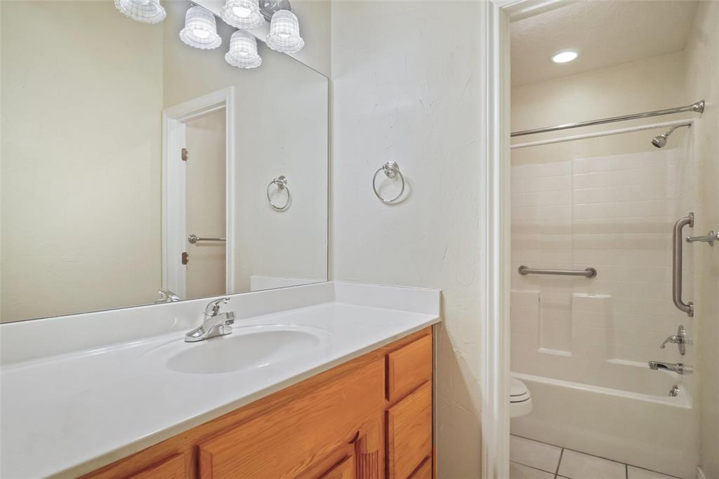 424 Half Moon Way Runaway Bay, TX 76426 - Photo 15 of 21 a bathroom with a sink double vanity granite tub shower and a mirror