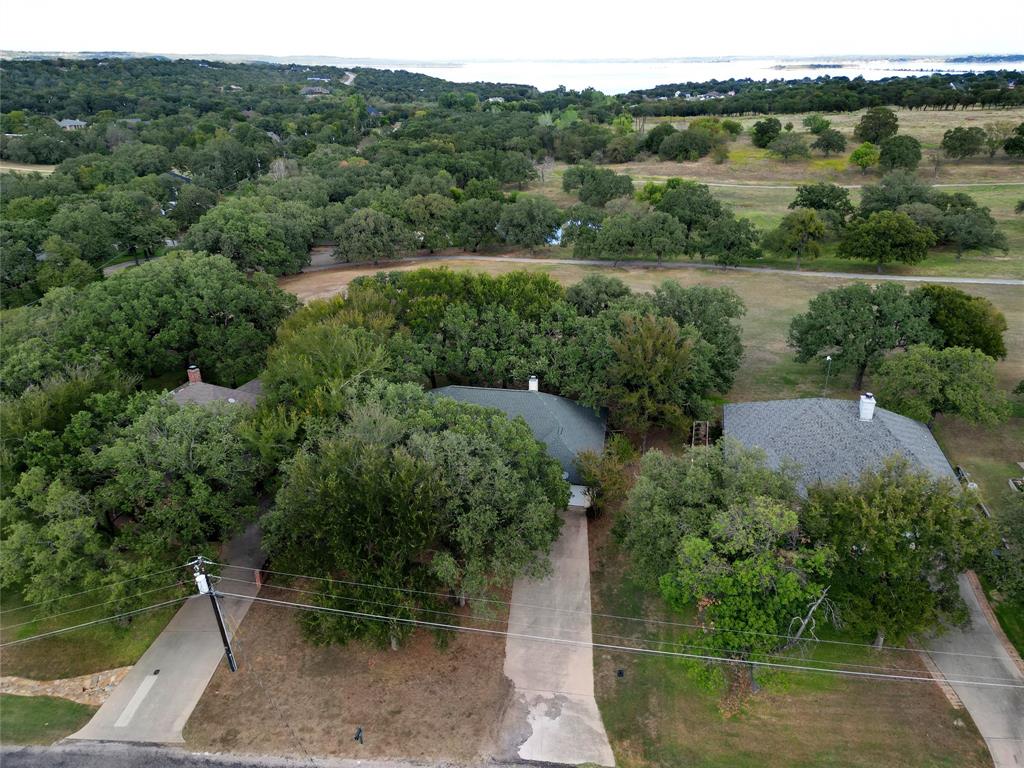 424 Half Moon Way Runaway Bay, TX 76426 - Photo 21 of 21 an aerial view of a house with a yard