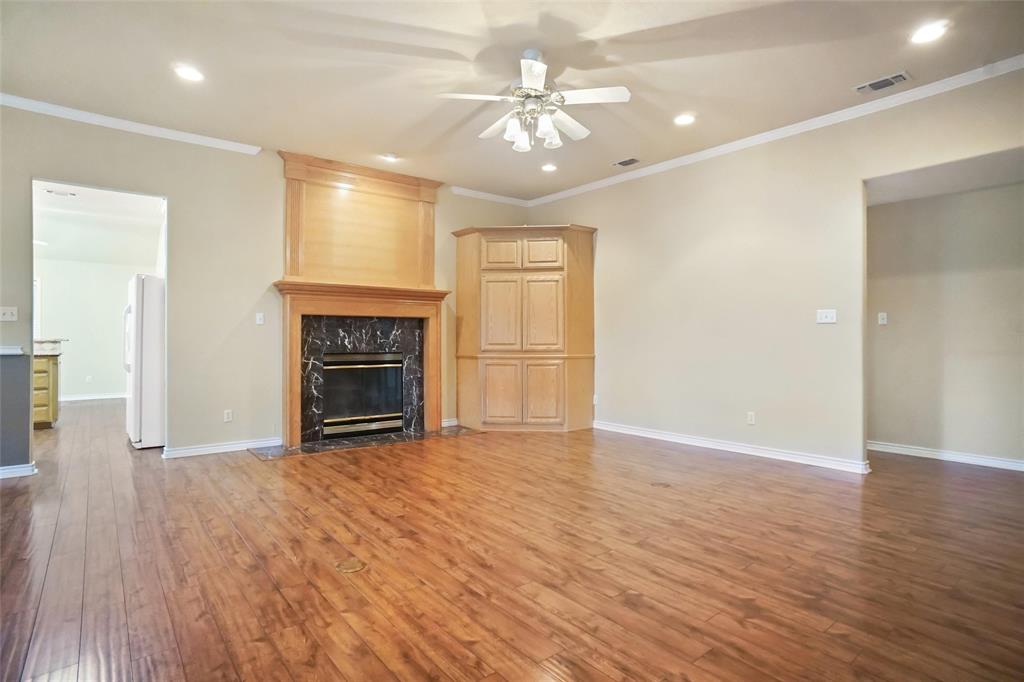 424 Half Moon Way Runaway Bay, TX 76426 - Photo 3 of 21 a view of an empty room with a fireplace and a window