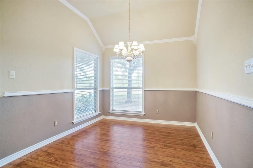 424 Half Moon Way Runaway Bay, TX 76426 - Photo 5 of 21 wooden floor in an empty room with a window