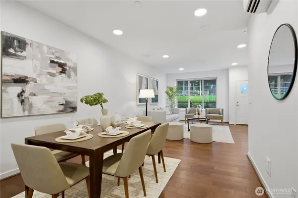 a view of a dining room with furniture window and wooden floor