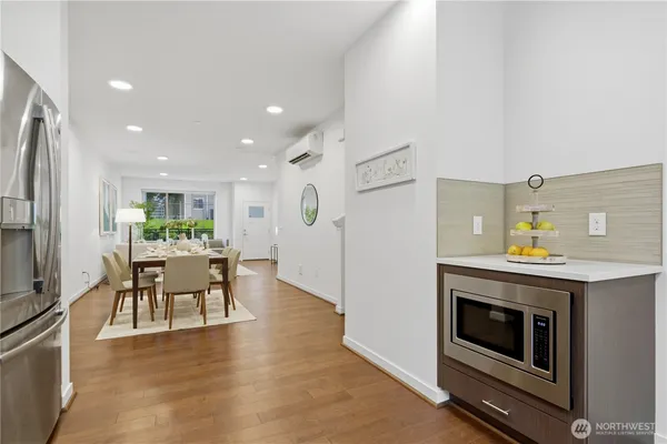 a view of kitchen with furniture and wooden floor