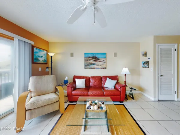 a living room with furniture and a rug