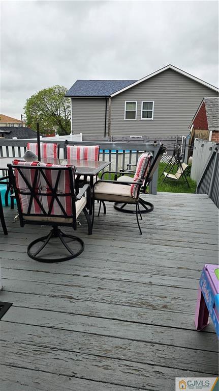 662 Jacques Street Perth Amboy, NJ 08861 - Photo 6 of 11 a view of a chairs and table in patio