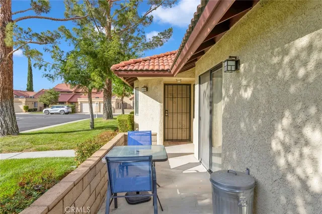 a porch with outdoor seating and yard