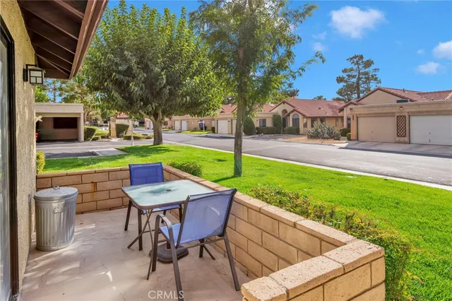 a view of a house with a yard porch and sitting area