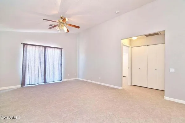 a view of an empty room with a window