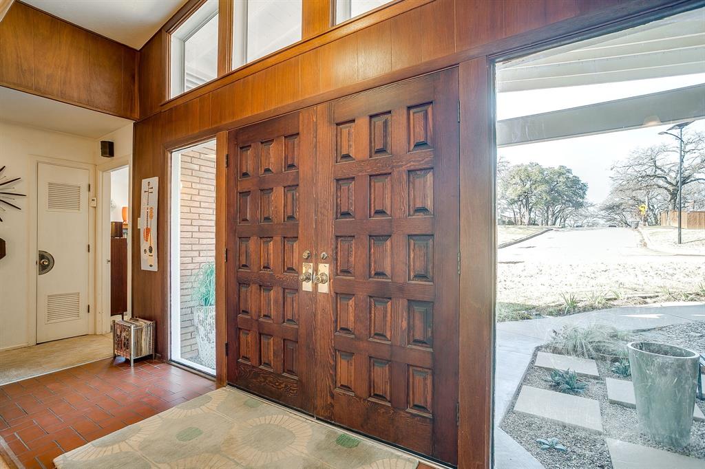 1525 Jenson Road Fort Worth, TX 76112 - Photo 8 of 40 These doors are incredible and the picture glass on either side frames them beautifully!