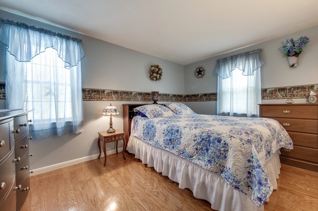 153 Leslie Road Rowley, MA 01969 - Photo 15 of 21 a bedroom with a bed and a large window