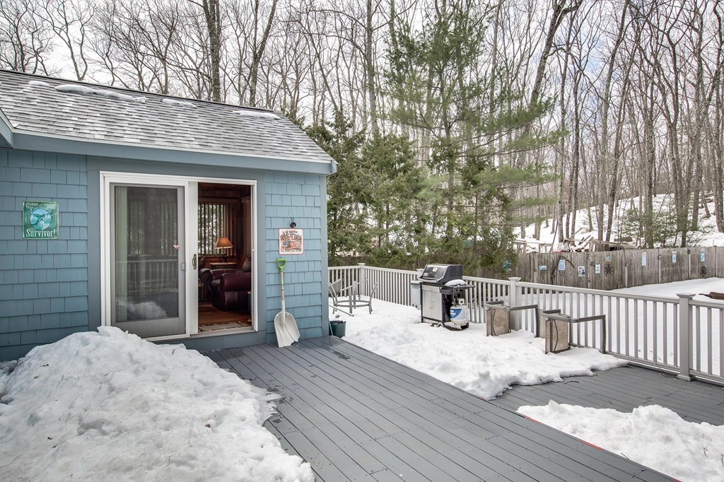 153 Leslie Road Rowley, MA 01969 - Photo 20 of 21 a view of a house with wooden deck and furniture