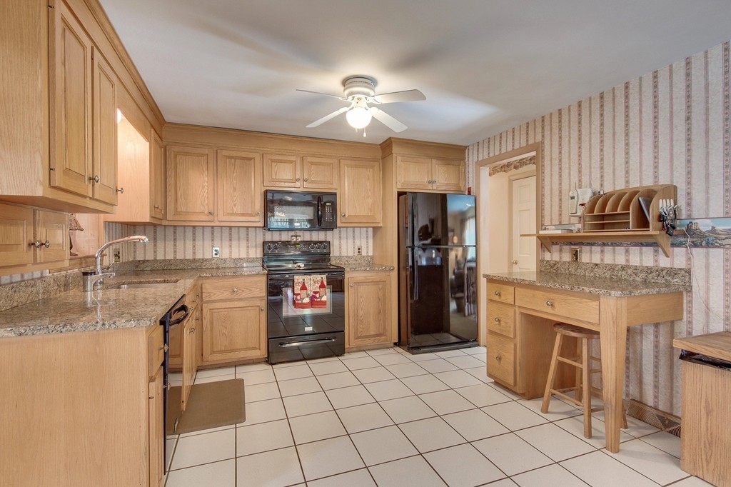 153 Leslie Road Rowley, MA 01969 - Photo 2 of 21 a kitchen with refrigerator cabinets and a sink